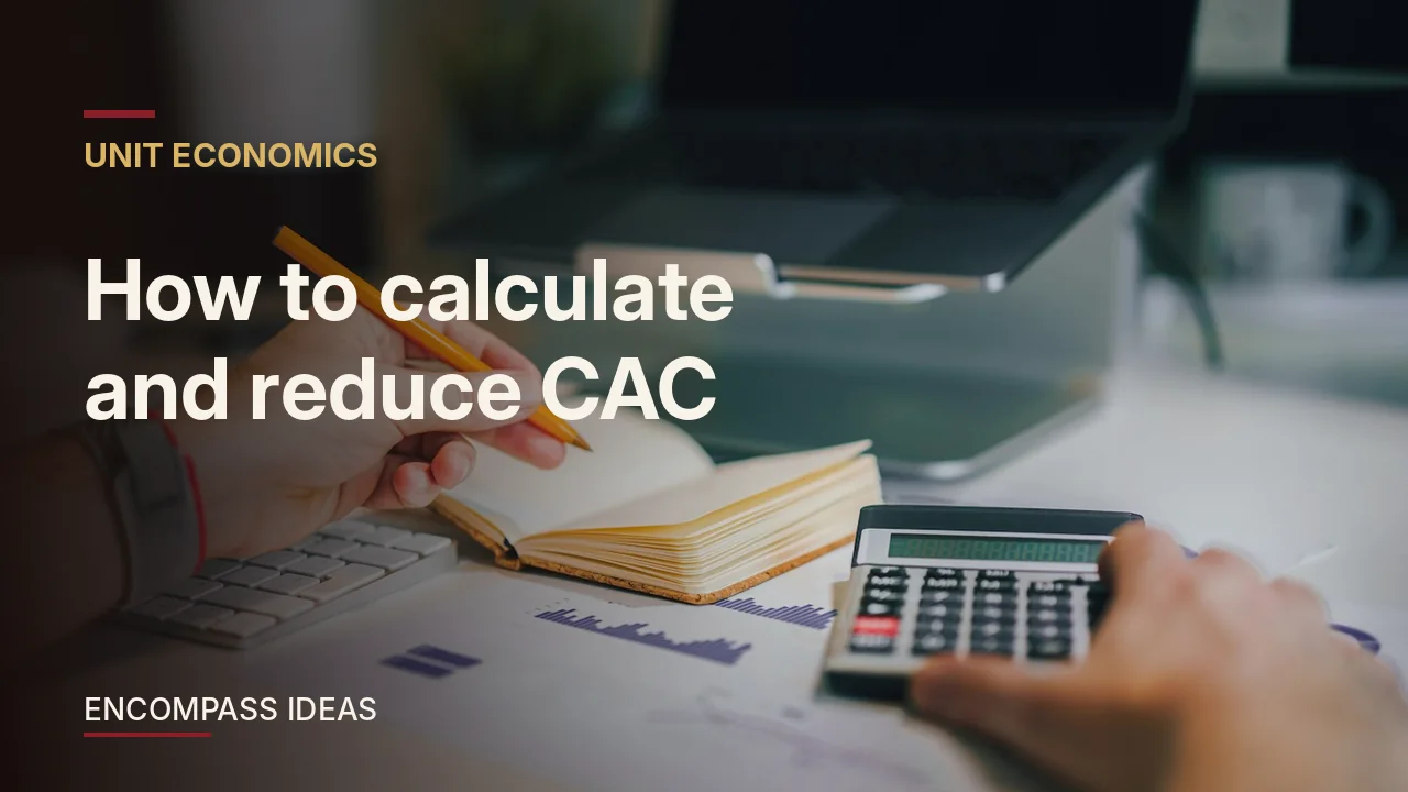 How to calculate and reduce CAC: a person at a desk with a calculator and notebook